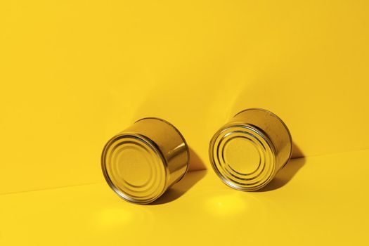 Canned food tin on yellow studio background
