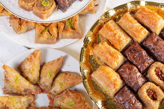 Assorted baklava- A Turkish sweet arranged on a decorative plate. Middle eastern food photography.