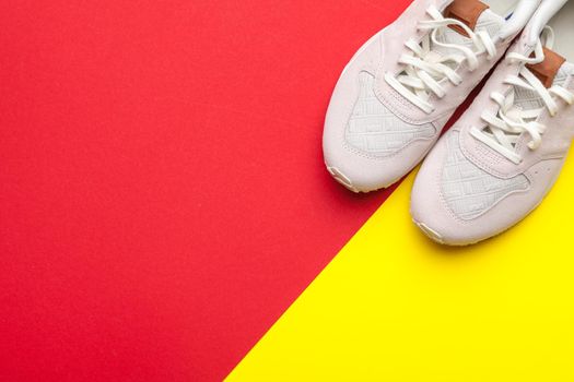 Pair of sport shoes on colorful background. New sneakers. creative photo.