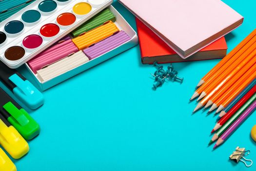 school supplies at abstract colorful background texture. creative photo.