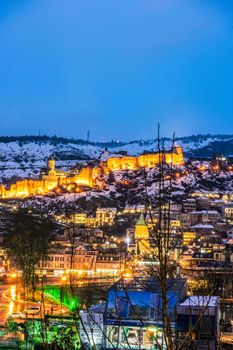 Snowing in Tbilisi city in the evening