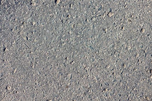 Dark gray grunge rough surface of asphalt