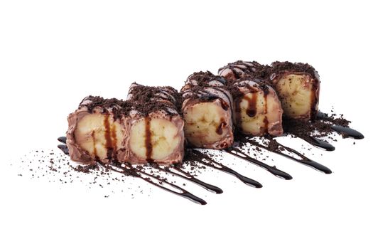 Fruit sushi rolls with chocolate cream and banana isolated on white