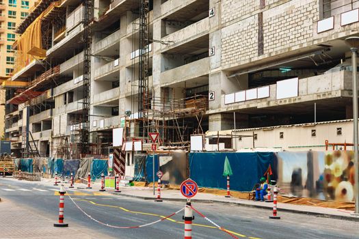 Building construction site in a street in Dubai