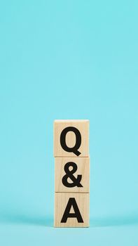 Q and A - acronym from wooden blocks with letters, questions and