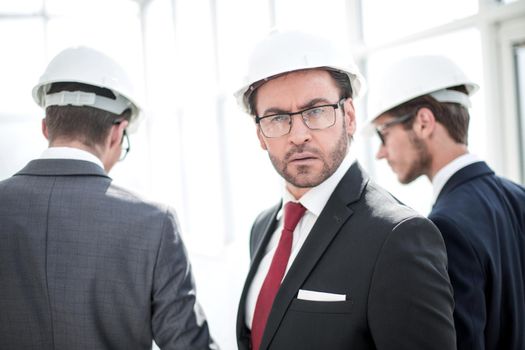 portrait of a confident businessman in a protective helmet