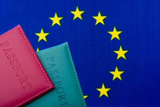 Against the Flag of the European Union are passports.