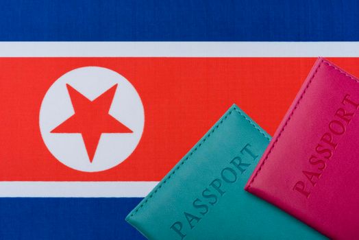 Against the Flag of North Korea are passports.