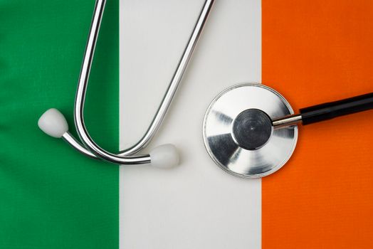 Irish flag and stethoscope. The concept of medicine.