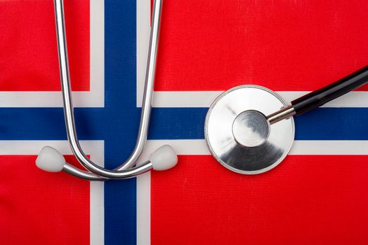 Norwegian flag and stethoscope. The concept of medicine.