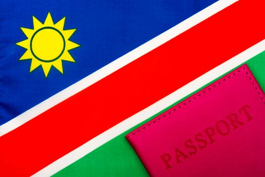 On the background of the flag of Namibia is a passport.
