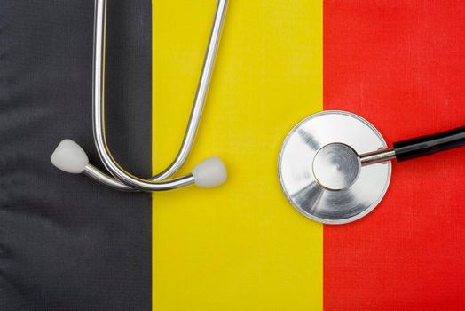 Belgian flag and stethoscope. The concept of medicine.