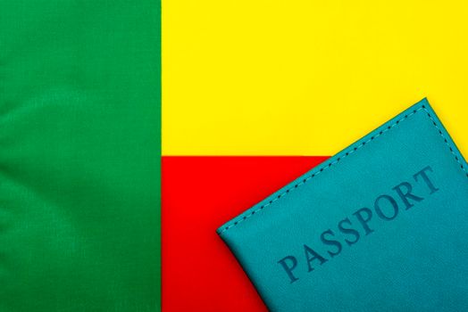 On the background of the flag of Benin is a passport.