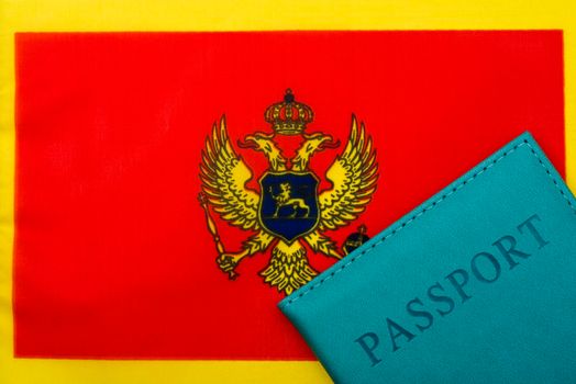 On the background of the flag of Montenegro is a passport.