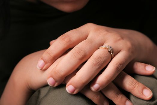 Close up of women hand with wedding ring