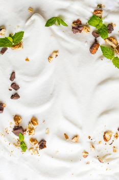 Whipped cream of egg whites with chocolate, nutmeg and mint.