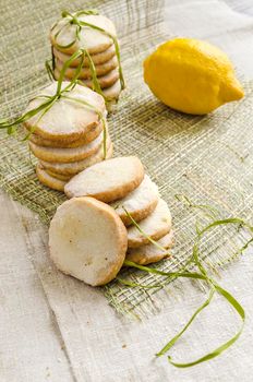 Homemade lemon sugar cookies on linen tablecloth