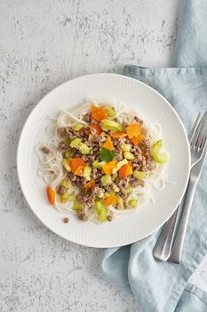 Delicious rice pasta with mince meat and vegetables, top view