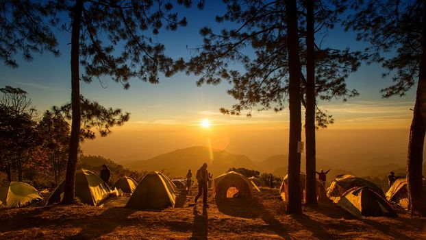Chiang Mai, Thailand - April, 2022, View of morning mist and sun rise at Doi Ang Khang mountain amazing viewpoints in Chiangmai,place for camping with tent on winter, Chiang Mai, Thailand.