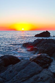 Sunset on the rocky shore. Tyrrhenian Sea.