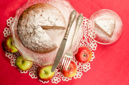 Applesauce raisin rum cake for christmas table, blurred background