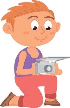 Boy making photo with camera. Cute smiling kid