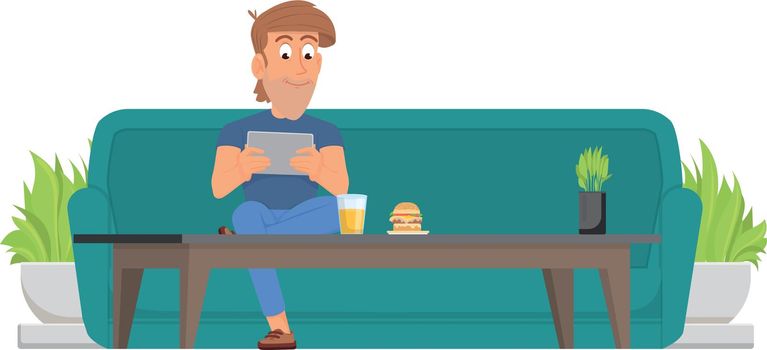 Man sit on couch at coffee table with tablet. Guy relaxing in cafe