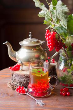 natural vitamin tea with fresh red currant berries, summer fruit harvest, abundance