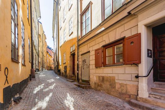 STOCKHOLM, SWEDEN - July 06, 2017. Narrow streets in historic part of town. Old fashioned buildings in Gamla stan.
