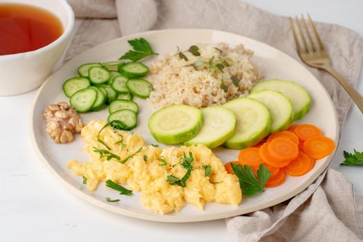 Balanced gluten free food, brown rice & zucchini with scramble, dash fodmap diet