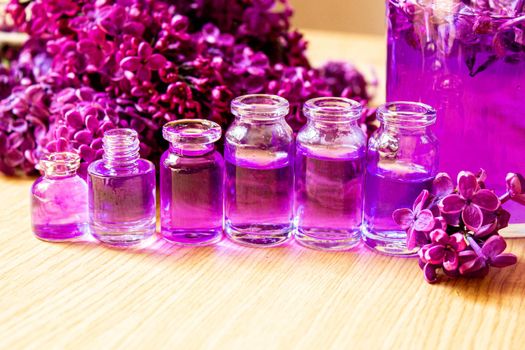 lilac oil in small bottles. selective focus