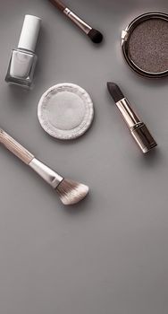 Beauty, make-up and cosmetics flatlay design with copyspace, cosmetic products and makeup tools on gray background, girly and feminine style