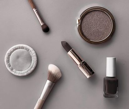 Beauty, make-up and cosmetics flatlay design with copyspace, cosmetic products and makeup tools on gray background, girly and feminine style