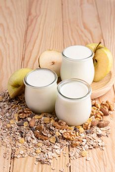 high angle plain yogurt jars with oats apple