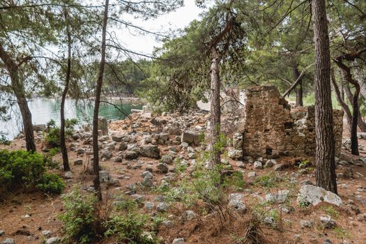 Northern Harbour of ancient city Phaselis. Ruins of Greek city on coast of ancient Lycia. Architectural landmark in Turkey.