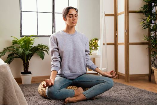 front view young woman meditating home