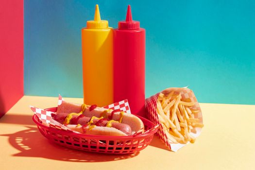 food assortment with hot dog sauce bottles