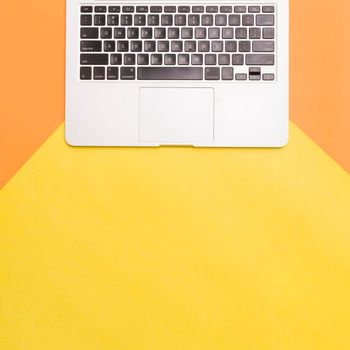 flat lay laptop colorful background