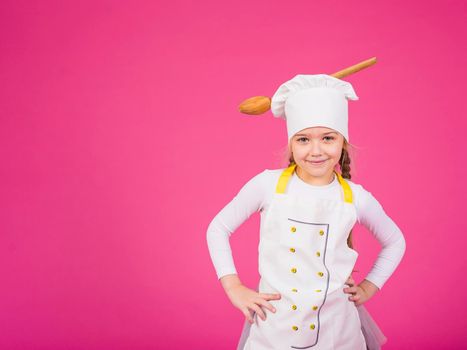 cute girl cook standing with ladle chefs hat
