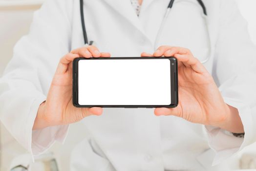 close up doctor holding smartphone mock up