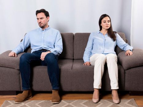 angry male woman sitting couch