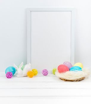 easter eggs nest with blank frame table