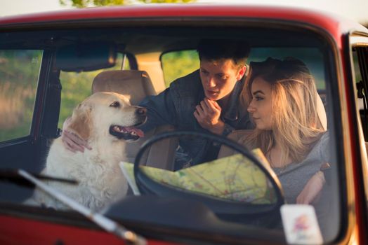 young family road trip with their dog