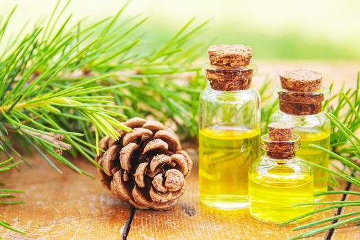 Fir tree essential oil in small bottles. Selective focus