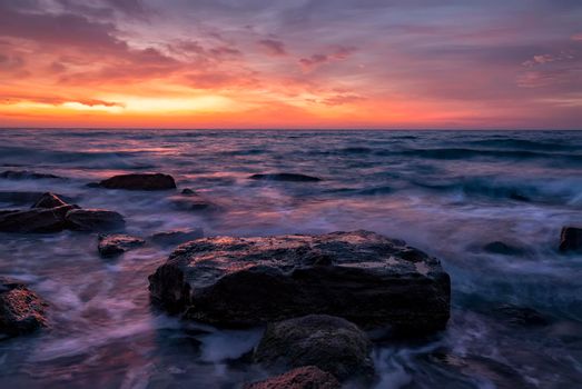 Seascape with rocks during sunrise. Stunning natural seascape. Sea sunrise at the Black Sea coast. 
