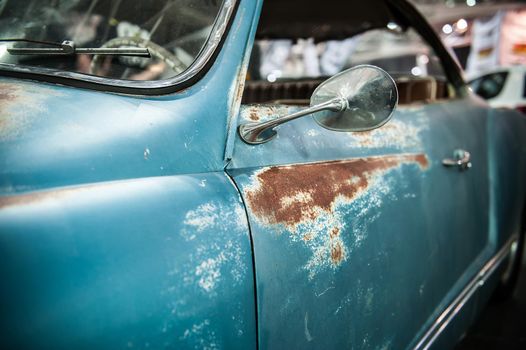 Vintage blue car with rust