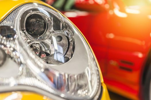 Closeup on an headlight of a sport car