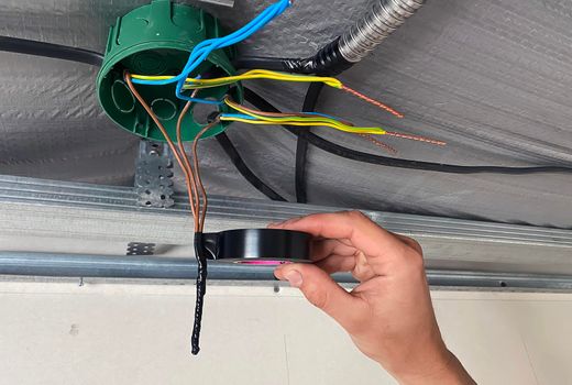 Electrical wiring of the junction box, installation, twisting of the box by an electrician.