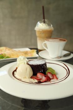 Chocolate Lava Cake with ice cream and beverage