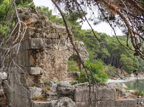 Northern Harbour of ancient city Phaselis. Ruins of Greek city on coast of ancient Lycia. Architectural landmark in Turkey.